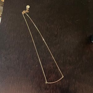 Gold chain necklace with silver bar